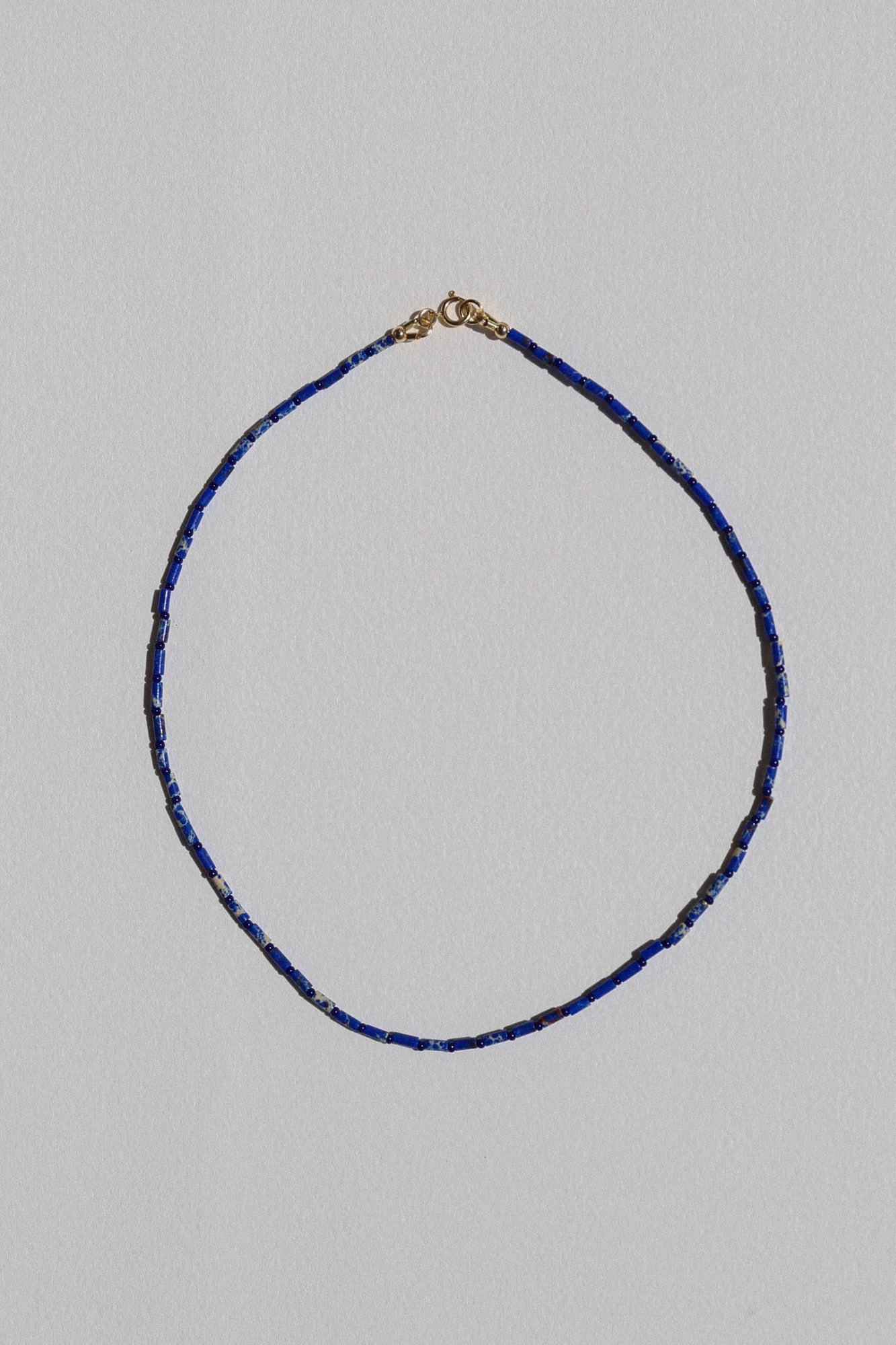 
                  
                    FRANCIS NECKLACE IN BLUE
                  
                